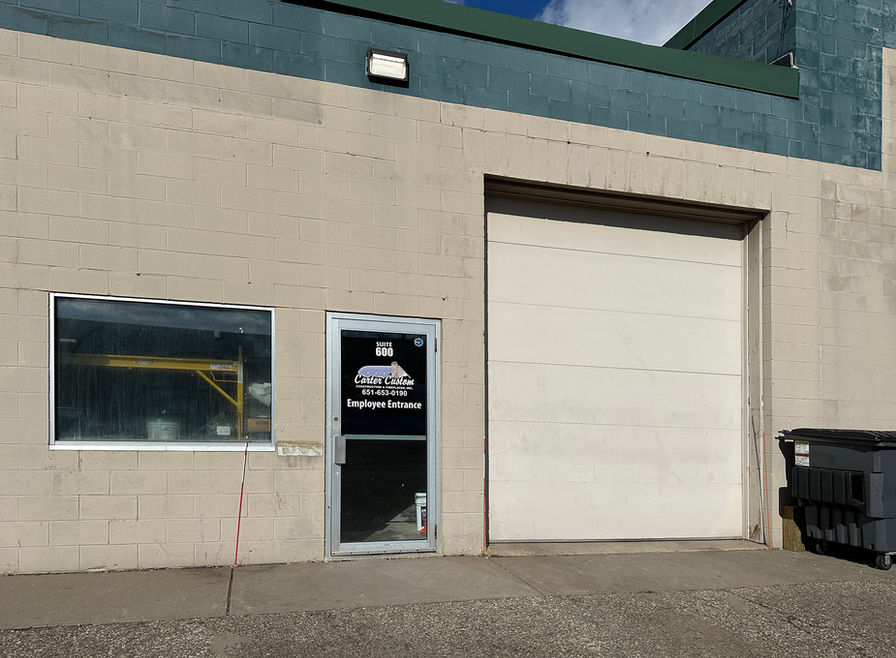 Entrance to suite 600 plus a window and drive-in.