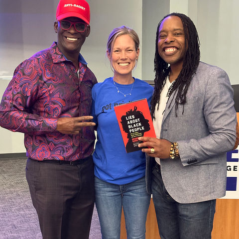 Three people smiling. One person holds a book titled, Lies About Black People.