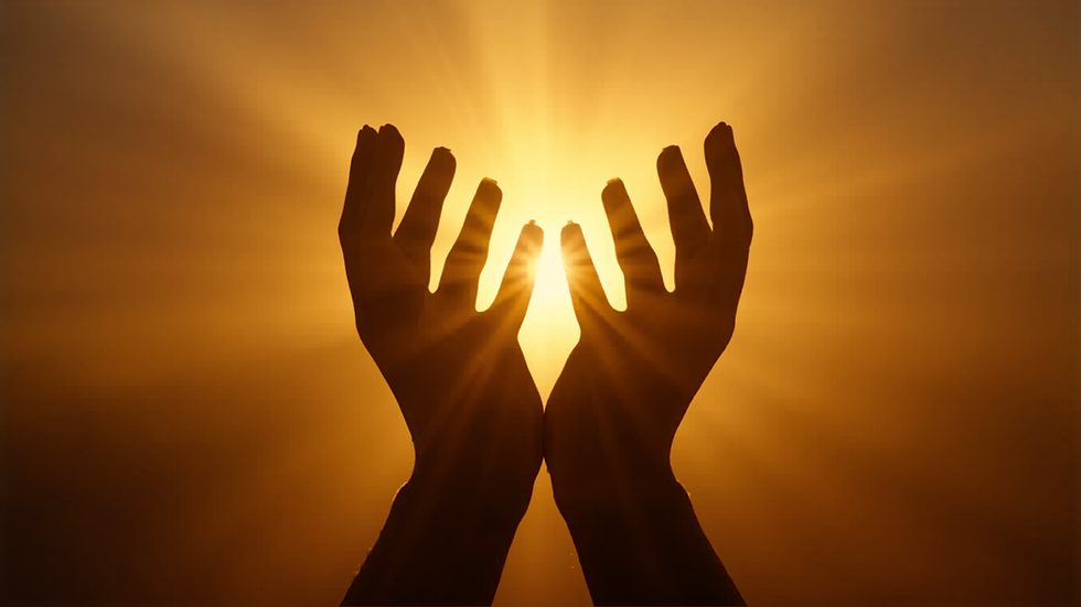 Silhouetted hands raised towards a bright, radiant sun with rays streaming through fingers against an orange sky. Peaceful and uplifting mood.