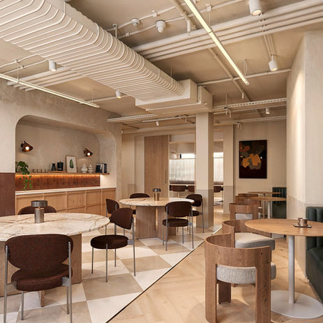 Contemporary workplace social hub CGI visualisation with collaborative seating, timber joinery and daylight-filled office interiors in London.