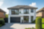Modern white two-story home, black framed windows, dark garage, paved driveway.