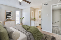 arbor-oaks-apartments-lubbock-staged-bedroom-vanity-natural-light.jpg