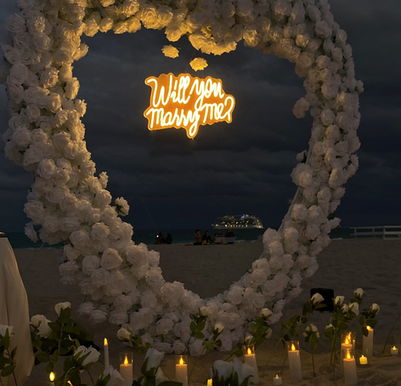 Propose in Miami Beach and create an unforgettable moment with a fully planned engagement experience in Florida.
We specialize in Miami beach proposals, sunset proposals in Miami, and romantic engagement setups designed for couples looking to say YES in the most magical way. From private proposals on the beach to luxury proposal experiences in Miami, we plan and design every detail to make your moment perfect.

Looking to plan your Miami proposal? Whether you’re searching for proposal ideas in Miami, romantic proposal Miami Beach, or a unique sunset engagement in Florida, our team creates beautiful, stress-free proposals tailored to your vision.
YES moments, elegant décor, candles, flowers, glowing signs, and unforgettable memories — all in one seamless experience.

¿Buscas una propuesta de matrimonio en Miami?
Creamos propuestas románticas en Miami Beach, propuestas al atardecer, y propuestas privadas y de lujo en Florida. Diseñamos cada detalle para que tu propuesta sea íntima, elegante y completamente inolvidable.

If you’re dreaming of a Miami proposal, a Florida beach engagement, or a romantic “YES” moment in Miami, you’re in the right place.