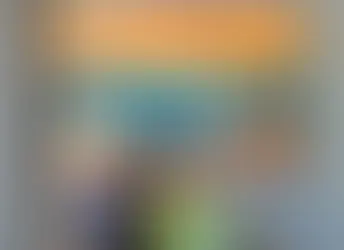 Luis Posada with one of his paintings