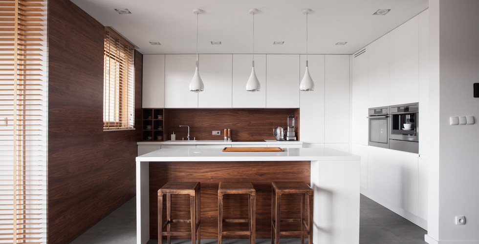 Small U-Shape Kitchen Remodel Construction Project in Doral, Florida with Matt White and Unfinished Walnut Wood Mix Slab Flat Doors Cabinets, Built-In Stainless Steel Appliances Package, White Quartz Stone Countertop, Center Island with 4 walnut wood stools, White Ceiling with 3 White Pendants over center of island.