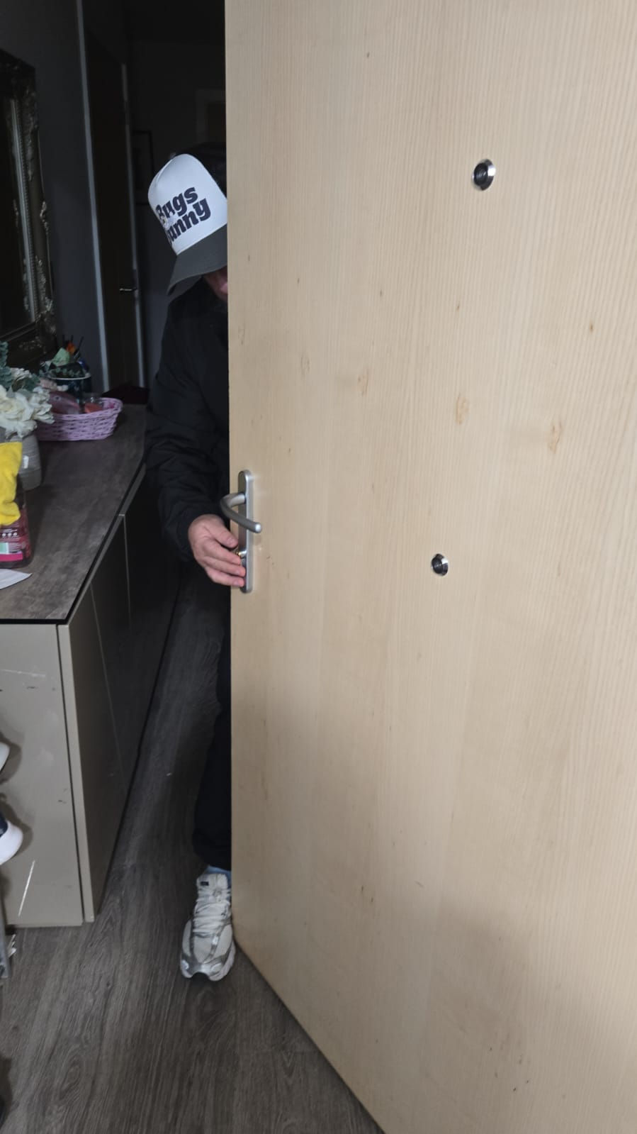 Professional locksmith repairing a door lock in Acton W3