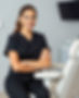 cosmetic nurse in black scrubs white medical chair in background.jpg