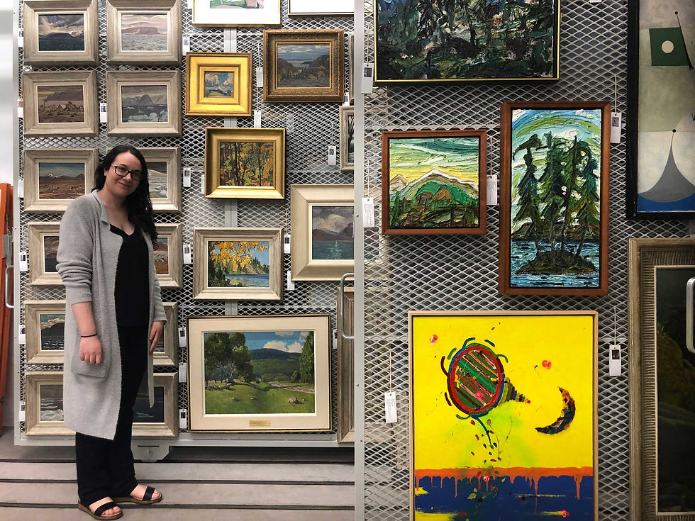 A woman (the designer) is positioned before a wall adorned with multiple paintings in an art gallery's vault, showcasing her appreciation for art.