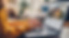 laptop-table-with-house-hunting-website-open-closeup-woman-hands.jpg