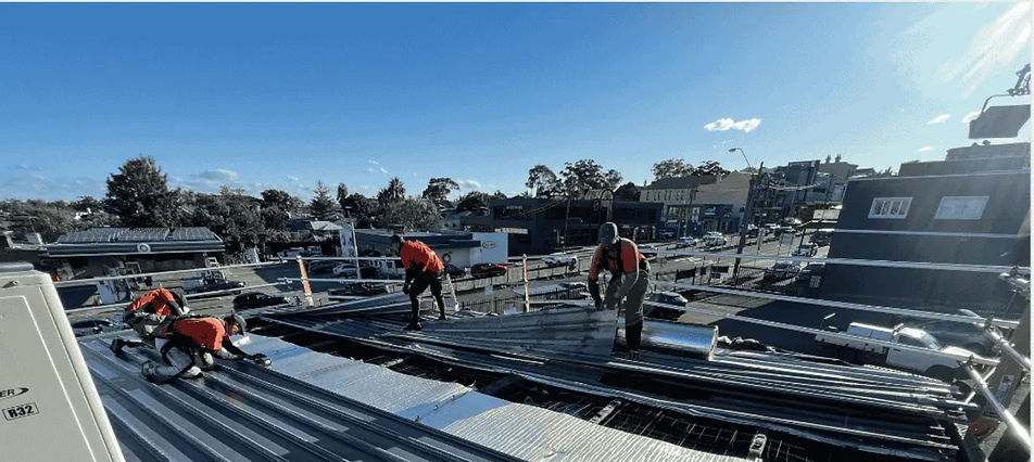 Roofing Crew on Metal Roof - (Small)_edi