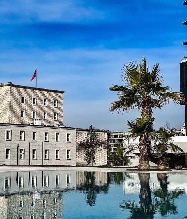 Luxury outdoor swimming pool and hotel building at MAK Albania Hotel