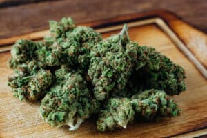 cannabis flower on wooden background