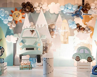 Adventure-themed backdrop at a premium birthday hall in Chennai featuring 3D travel-inspired decor.
