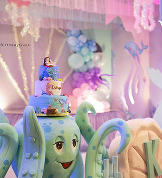 Creative mermaid theme decor at birthday party halls in ECR Chennai featuring a custom octopus-designed cake.