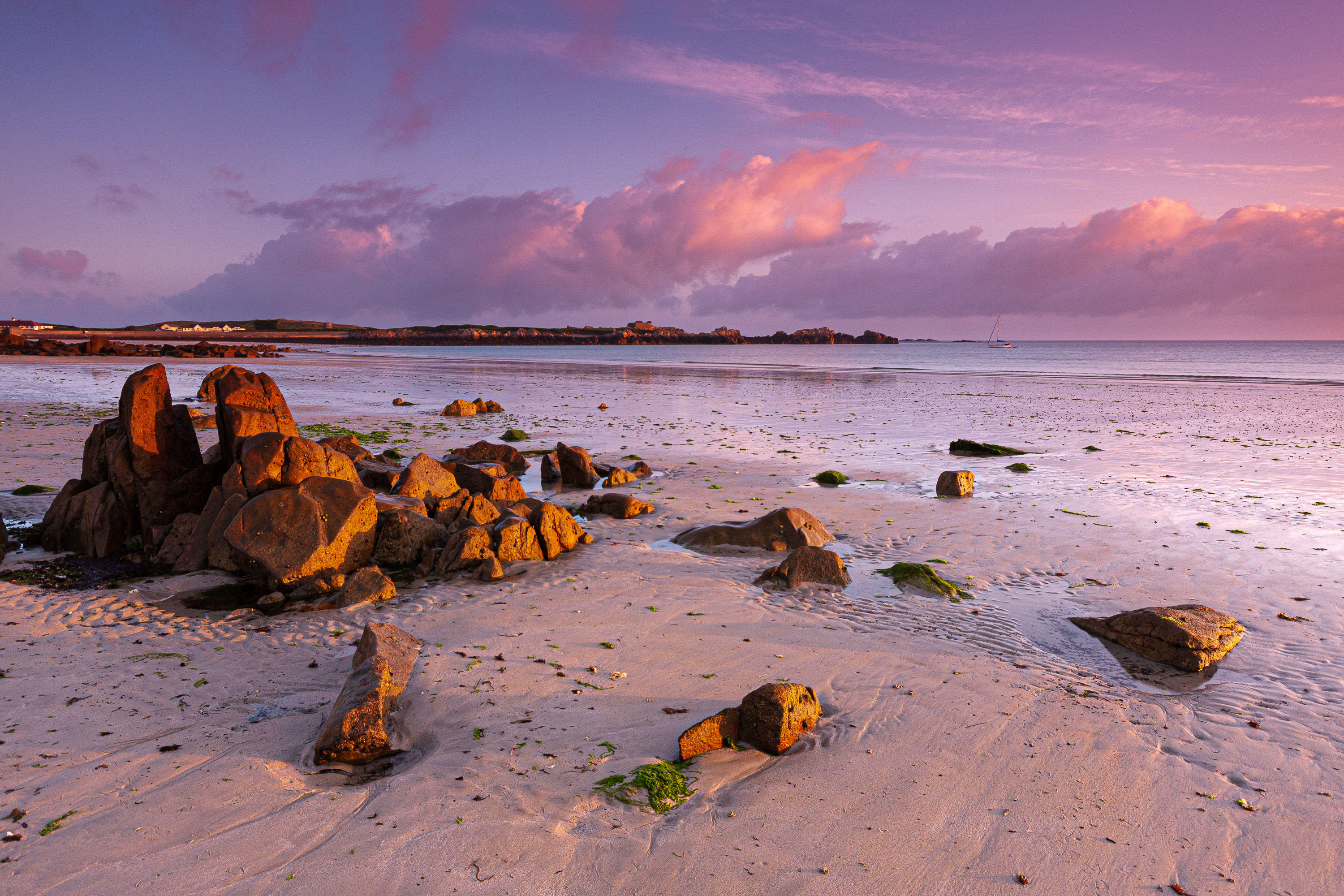 Early morning light paints the landscape at L'Ancresse Beach, Guernsey