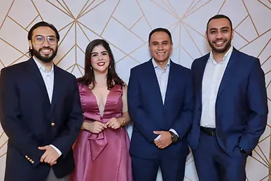 Four smiling corporate professionals