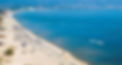 beach sunbeds umbrellas boats sea skyview