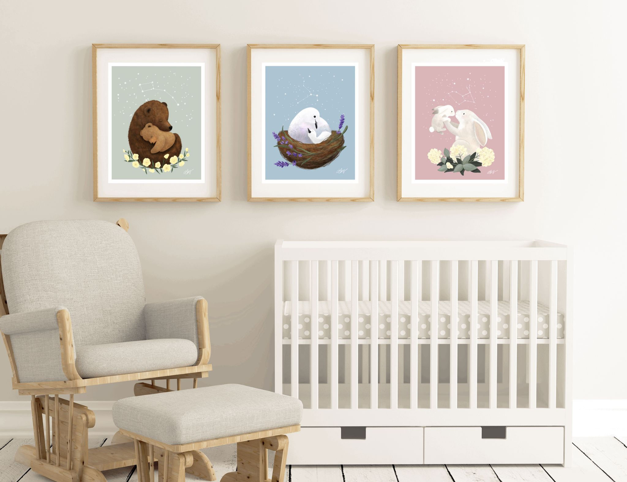 3 prints in "To the Stars and Back" art collection hung in frames above a crib in a nursery