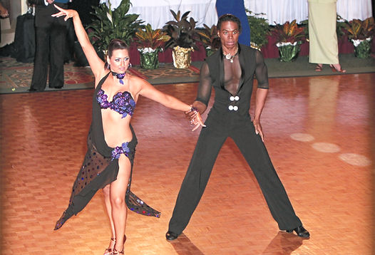 Couple performing Ballroom dance at a Montreal DanceSport competition, demonstrating precision and elegance