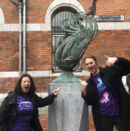 A corporate treasure hunt around Cork City with two team members finding a statue near Grand Parade