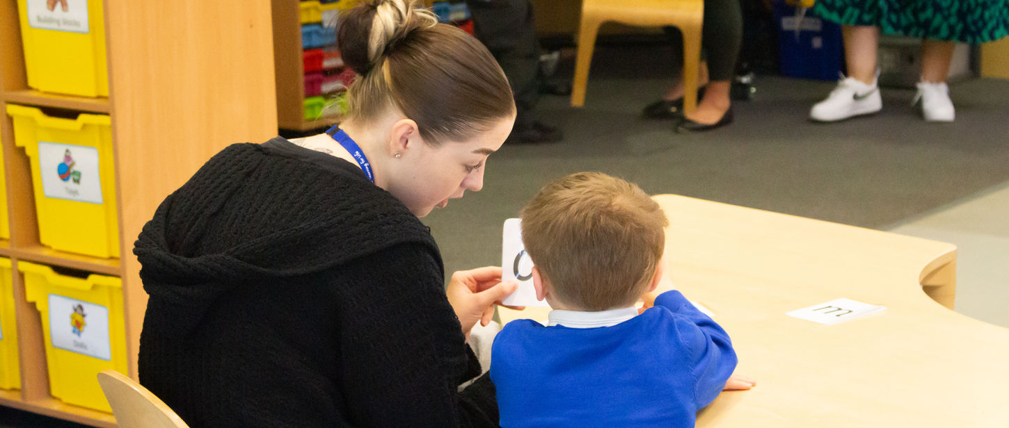 Staff member supporting child