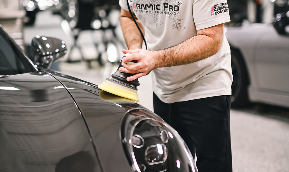 Professional mobile car detailing technician polishing a vehicle in Kansas City area