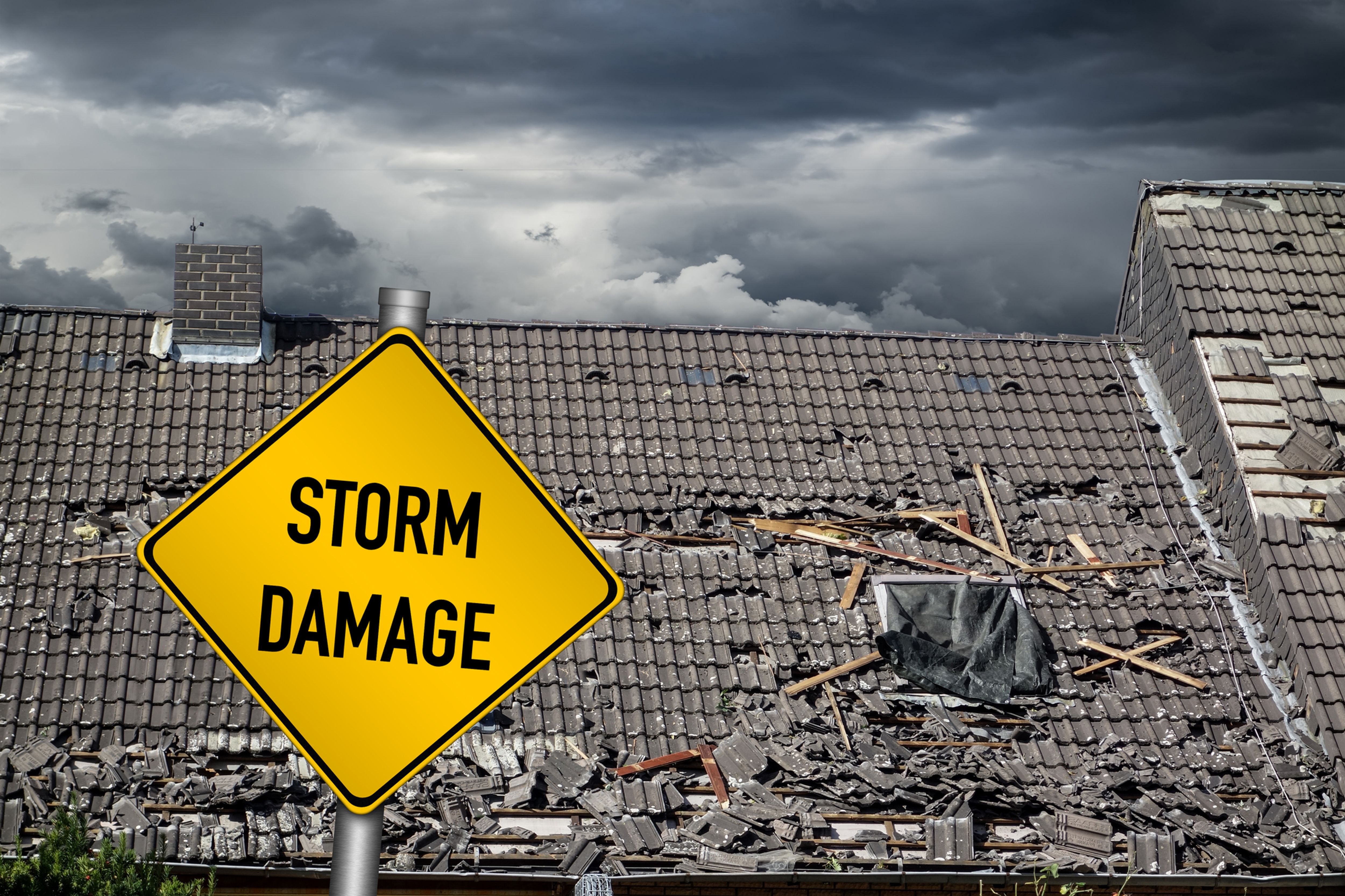A sign that says "Storm Damage"
