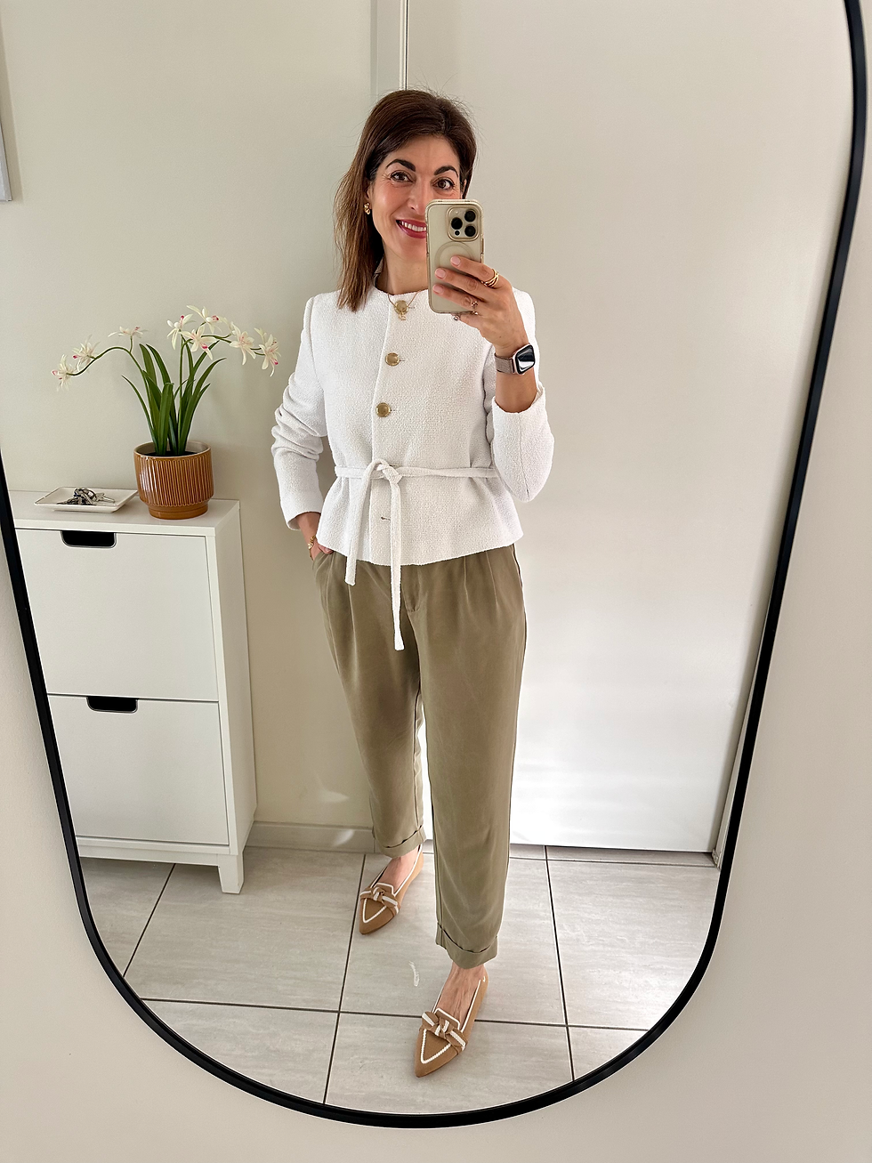 A versatile wardrobe featuring cotton trousers, and neutral everyday outfits for work, lunch, and casual days.