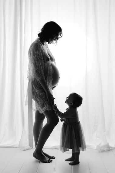 Maternity in studio mummy and daughter photoshoot in black and white