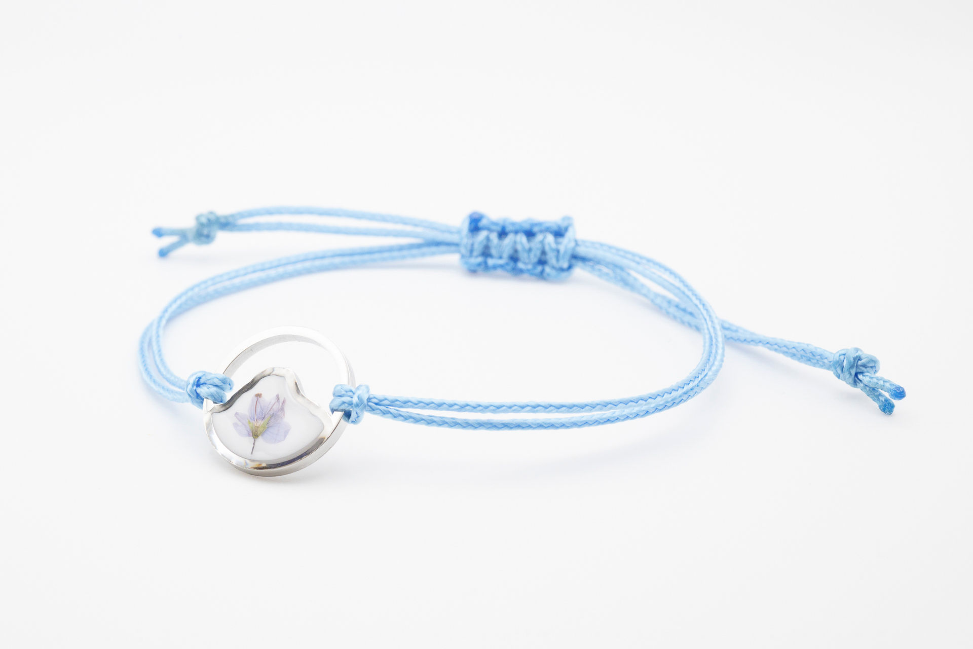Bracciale regolabile azzurro "Monte Bianco", con fiori di Veronica