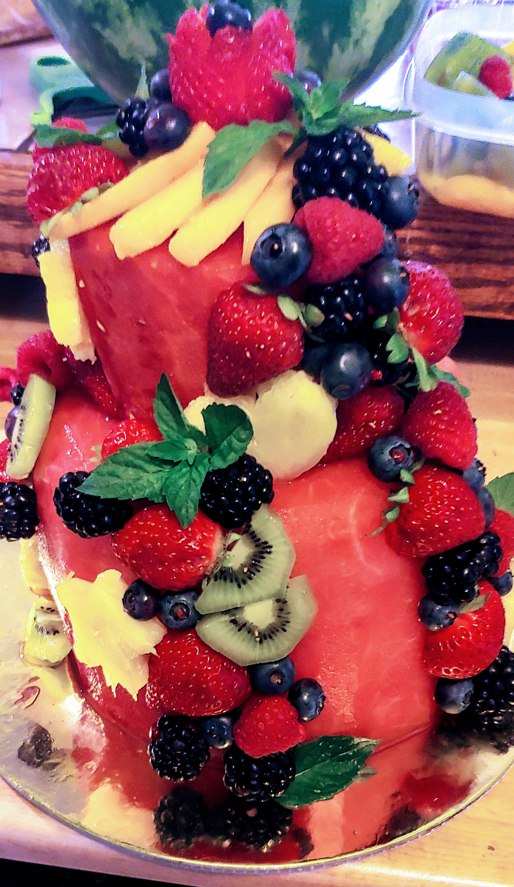2 tier watermelon cake with fresh berries and tropical fruit