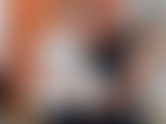 Two girls posing for a picture at the entrance of a gym.