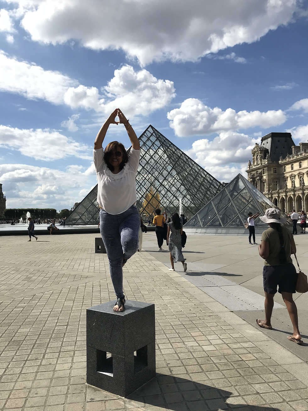 Mother doing yoga at the Lourve