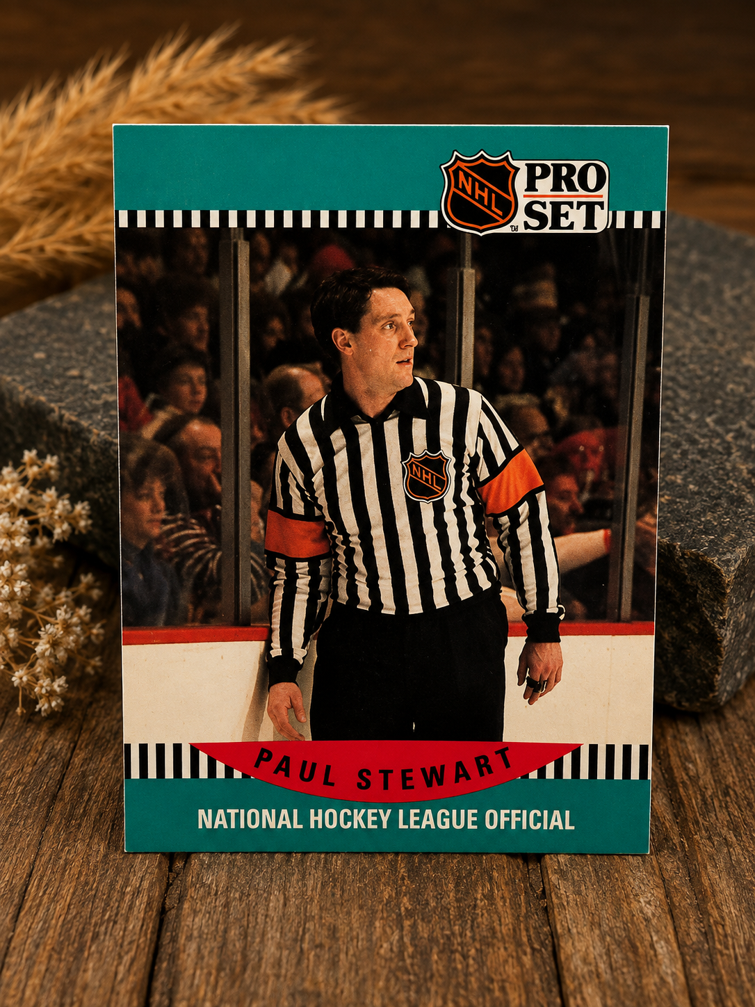 Product photography displaying the front and back of the 1990-91 Pro Set Paul Stewart #699 hockey card, standing upright agai