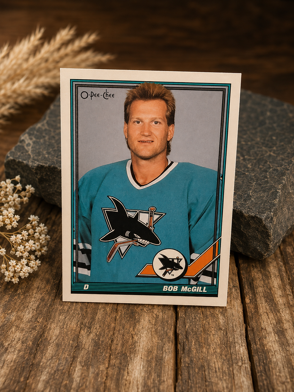 Product photography displaying the front and back of the 1991-92 O-Pee-Chee Bob McGill #216 hockey card, leaning upright agai