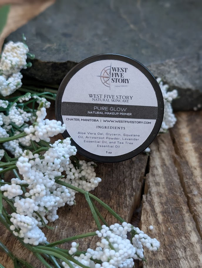 A top-down lifestyle photograph of the West Five Story PureGlow Natural Makeup Primer. The 30 ml amber glass dropper bottle f