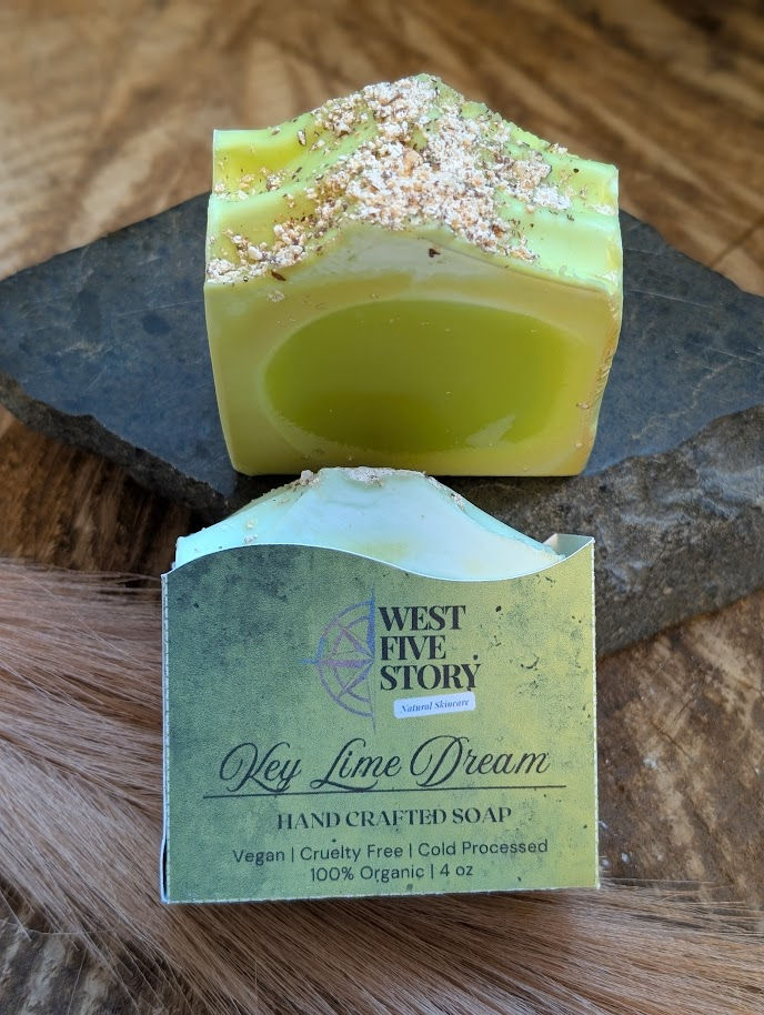 A lifestyle product photograph of "Key Lime Dream" Handcrafted Natural Soap by West Five Story. One 4 oz rectangular bar is d