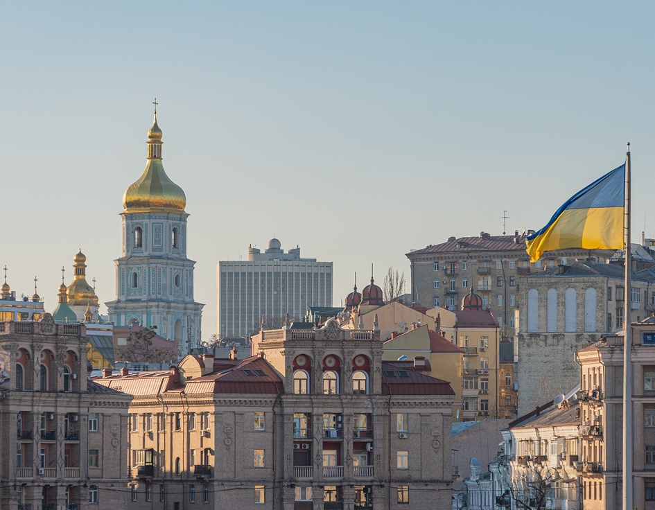 Ukrainian Flag With City In Background