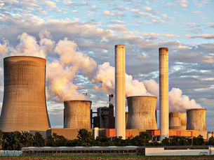 A nuclear power plant emitting steam into the atmosphere.