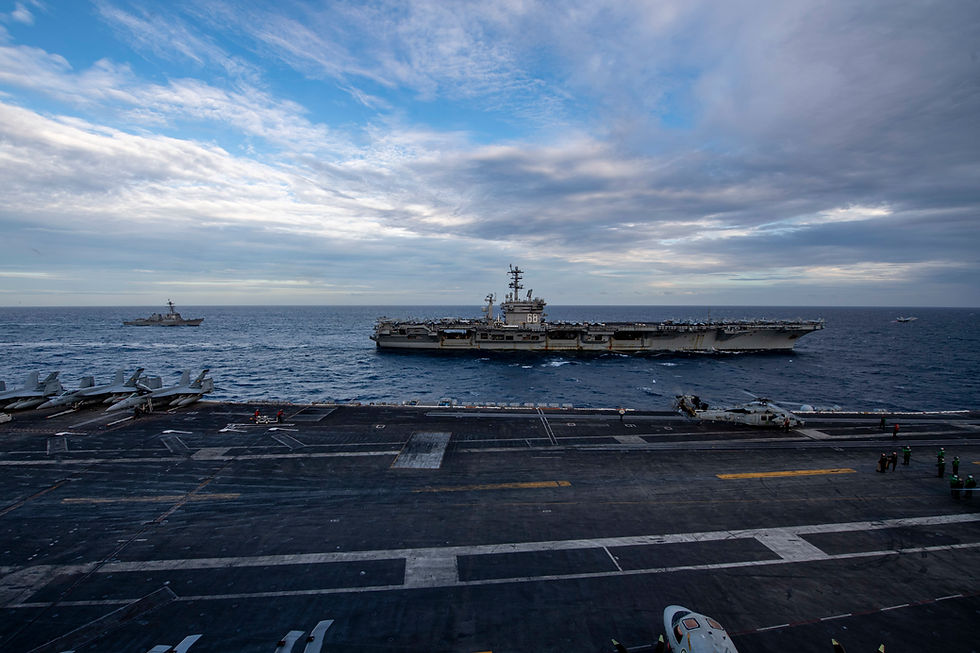 USS Theodore Roosevelt exercising with USS Nimitz in the open seas.
