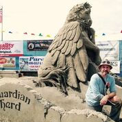 Artist Damon Langlois and his sand sculpture of Star from the Guardian Herd book series