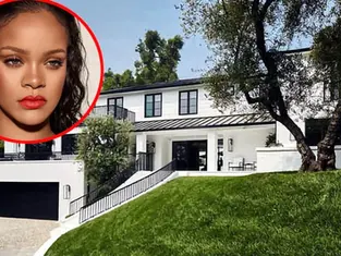 Police vehicles outside a luxury Los Angeles residence after shots were fired near a property associated with Rihanna.