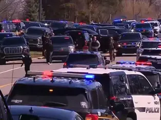 Police vehicles and emergency responders outside Temple Israel synagogue in West Bloomfield, Michigan.