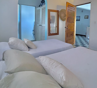 HABITACION 1 CALIPSO BEACH HOUSE PLAYA BLANCA SAN ANTERO 1.png