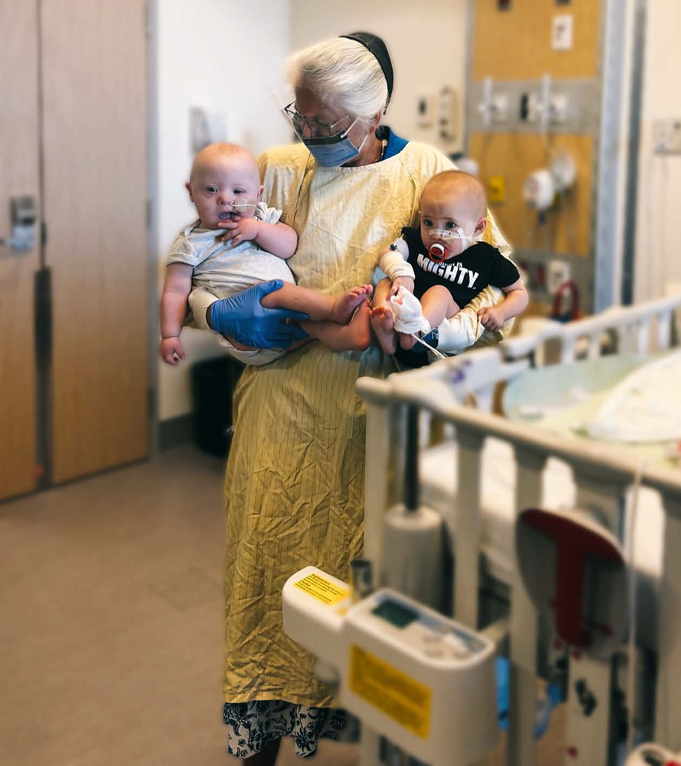 Nurse at BC Children's Hospital with Bensyn and Luna during a long stay during 2025.