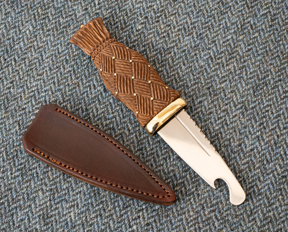 Sgian Brew (a traditional Scottish Sgian Dubh with a safety bottle-opener blade) with a carved handle in Caol Ila Whisky barr