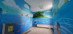 Underwater themed stairwell featuring scuba diver, fish, and ocean elements at elementary school