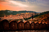 Man overlooking Amber Fort, breathtaking sunset view, @club_travels, Car Rental In India.