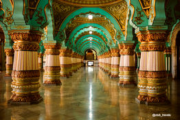 Ornate columns and ceiling inside a palace; Car Rental In India