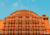 Hawa Mahal palace in Jaipur, India against blue sky background, car rental in India